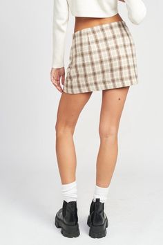 Add style to your wardrobe with this Square Printed Mini Skirt. Crafted from 100% polyester fabric for a comfortable fit, with a fully lined interior for added coverage. 💁‍♀️😍 SIZE & FIT :MODEL WEARS SIZE SMALLMODEL'S HEIGHT 5'9 Made In: IMPORTED Fabric Contents: 100% POLYESTERLINING: 100% POLYESTER Emory Park is a Young Contemporary clothing brand based in Los Angeles. We are committed to produce styles that are effortless and trendy using high quality fabrics. Our mission is to design clothe Printed Mini Skirt, Brown Flannel, Park Square, Cardigan Sweater Coat, Contemporary Clothing, Denim Accessories, Plaid Mini Skirt, Contemporary Outfits, Square Print