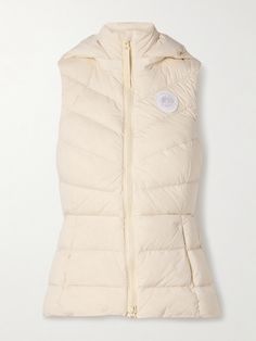 Canada Goose's quilted down 'Clair' vest is made from the brand's 'Aira' - a lightweight fabric with two-way stretch that's water-repellent and wind-resistant. It tapers at the waist to define your shape and has a convenient detachable hood. Fitted Quilted Nylon Vest, Canada Goose Women, Raffia Bag, Ballet Pumps, Down Vest, Sports Suit, Detachable Hood, Ski Wear, Clothes Collection