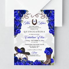 a wedding card with blue flowers and cowboy boots in the center, on top of an envelope