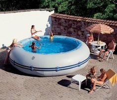 people sitting around in an inflatable swimming pool