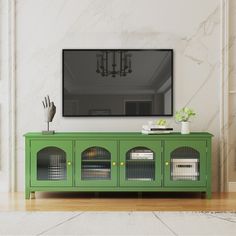 a green entertainment center in a living room