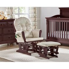 a baby's rocking chair and foot stool in a room with a teddy bear