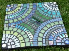 an image of a mosaic tile on the ground with text overlaying that reads mosaic stepping stone 7 flick - photo sharing