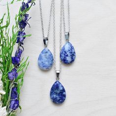 This necklace is made from a sodalite stone which has been cut into a teardrop. The stone hangs from a silver plated chain. You can choose the length of the necklace you prefer. You will get a necklace at random. Please note that all necklaces are handmade and may differ from the pictured. The picture shows multiple necklaces. You will receive one necklace with one pendant. Ewelina Pas Jewelry Lapis Lazuli Teardrop Necklace For Gift, Teardrop Lapis Lazuli Necklace For Gift, Gift Teardrop Pendant Drop Necklace With Natural Stones, Silver Teardrop Crystal Necklace With Natural Stones, Multiple Necklaces, Necklace Layering, Teardrop Necklace, May 31, Necklace Silver