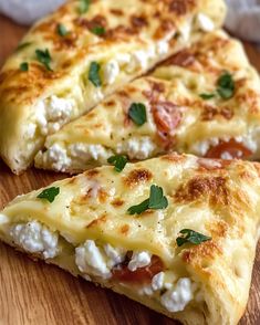 two slices of cheese pizza on a wooden cutting board