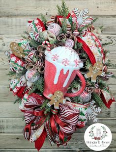 a christmas wreath with candy canes and hot chocolate