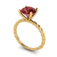 a yellow gold ring with a heart shaped red stone in the center, on a white background