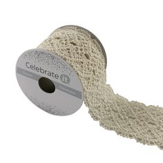 a roll of white crochet ribbon