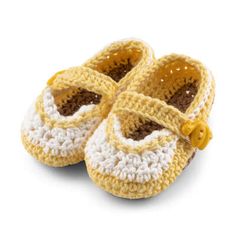 a pair of yellow and white crocheted baby shoes