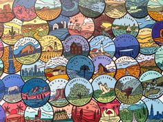 an image of many different colored buttons in the shape of a cityscape with buildings and mountains