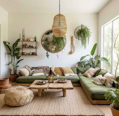 a living room filled with lots of green furniture and potted plants on the wall