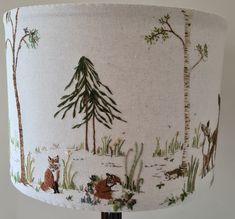 a lampshade with an animal scene on it