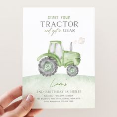 a hand holding up a card with a tractor on it and the words, start your tractor and get an glar