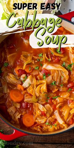 a pot filled with cabbage soup on top of a wooden table