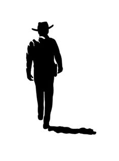 the silhouette of a man wearing a cowboy hat and carrying a bag on his back