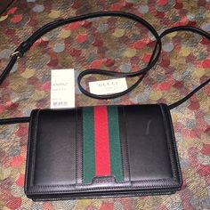 Black Signature Gucci Web Red & Green Striped Crossbody. Euc Only Used While On Vacation. %Authentic. There Are Faint Marks On The Bag( That’s Why I Took The Pictures W/Flash) However There Not Noticeable When Wearing. See Last Picture Of Rubbing On The Front Please See Photos & Ask Questions If Needed Sorry No Box Or Dustbag It Was Misplaced Upon Moving Bags Black, Gucci Bags, On Vacation, Green Stripes, Gucci Bag, Red Green, Dust Bag, Flash, Bag Lady