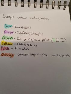 a notepad with some writing on it that is written in different colors and sizes