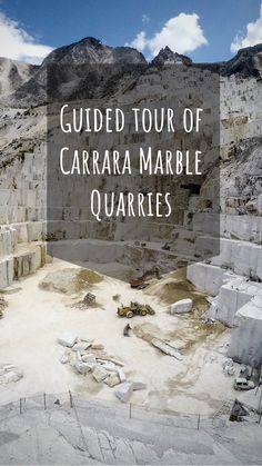 an image of a large quarry with the words guided tour of carrara marble quarrys