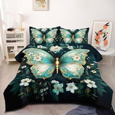 a bed covered in a green and white butterfly comforter set