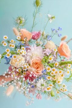 a bouquet of flowers on a blue background