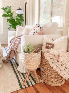 a living room filled with lots of furniture and decor on top of a wooden floor