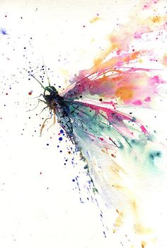 a colorful butterfly flying through the air with lots of paint splatters on it's wings