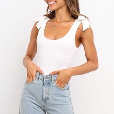 Brand New! A Square Neck Top In White With Long Knot Details At The Shoulder, A Low Scoop Back And Stretch Through The Body. Brand New. Bust: S 26” M 30 L 34” Spring Casual Bodysuit For Brunch, Casual Spring Bodysuit For Brunch, Casual Scoop Neck Summer Bodysuit, White Bodysuit For Day Out, Summer Day Out Bodysuit, Chic Scoop Neck Bodysuit For Summer, Summer Sleeveless Bodysuit For Day Out, Casual Summer Bodysuit For Brunch, Trendy Summer Bodysuit For Brunch