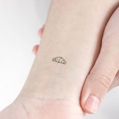 Tiny croissant temporary tattoo. * Set of three. * Size: 0.5 in / 1.2 cm (width) * Free shipping in orders over $10! * 20% off when you buy 3 items (+ Free Shipping), code: 3PLUS Tiny Temporary Tattoos last on average 2-5 days. We suggest placing on oil-free areas where skin does not stretch and keep them clean! Matching Tiny Tattoos Best Friends, Croissant Tattoo, French Tattoo, Smart Jewelry, Realism Tattoo, Tattoo Set, Finger Tattoos, Minimalist Tattoo, Cat Tattoo