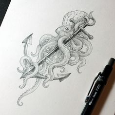 an octopus drawing on paper next to a marker