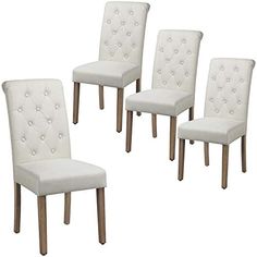 four white upholstered chairs with wooden legs and buttons on the backrests