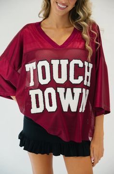 Score a touchdown in style with our TEAM COLORS TOUCHDOWN JERSEY. This jersey features varsity letters with the word "TOUCHDOWN" on the front - perfect for any game day. Show your school spirit by choosing your jersey color and letter color. It's sure to make you the envy of the crowd. MEASUREMENTS: S/M M/L L/XL Length 27.5” 29” 30” Waist 40-42” 42-44” 46-48” Varsity Letters, Judith March, Varsity Letter, Custom Jerseys, Custom Letters, Jersey Top, School Spirit, Style Profile, Large White