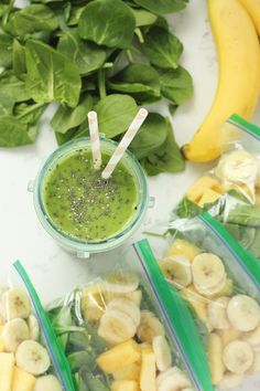 bananas, spinach, and other fruits are in plastic bags with straws on them