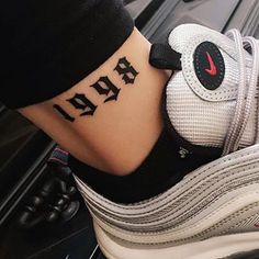 a person with a tattoo on their foot that says air max 95795