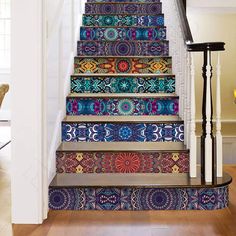 the stairs are decorated with colorful rugs and designs on them, as well as an area rug