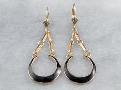 "These earrings strike the perfect balance of bold and feminine! Sleek geometric chains link swinging crescent shapes of jet black enamel. These earrings are perfect for a day in the office or a night on the town! Metal: 10K/14K Yellow Gold Material: Black Enamel Earrings Length: 46 mm Earrings Width: 16 mm Marks: \"10K CID 14K\" Stamped SKU #: 8ADYT64L Each piece has been identified and graded by a Graduate Gemologist who has been certified by the Gemological Institute of America (GIA). We have Yellow Gold Drop Earrings, Drop Earrings Gold, Fine Gold Jewelry, Gold Dangle Earrings, Cameo Ring, Enamel Earrings, Yellow Gold Earring, Fantasy Jewelry, Gold Earrings Dangle