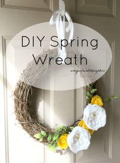 a diy spring wreath hanging on the front door