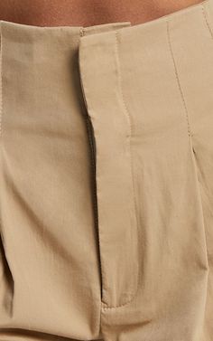 Elevate your summer wardrobe with our Elyssa Shorts in Camel. These pleat detail shorts are both stylish and versatile, perfect for casual outings or as a chic addition to your workwear collection. The A-line silhouette and tailored design create a flattering fit that accentuates your curves in all the right places. Made from high-quality polyester, these shorts offer comfort without compromising on style. With their warm brown hue, they easily pair with any top or blouse for endless outfit poss Khaki Shorts For Workwear, Khaki Workwear Shorts, Beige Knee-length Bottoms For Day Out, Wide Leg Shorts With Elastic Waistband For Work, Fitted Khaki Shorts For Work, Bermuda Workwear Bottoms, Beige Bottoms With Built-in Shorts For Workwear, Beige Short Bottoms For Workwear, Beige Short Bottoms For Work