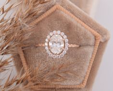 a close up of a diamond ring on top of fur