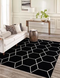 a black and white rug in a living room