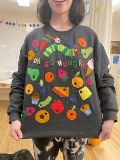 Very Hungry Caterpillar Sweater, Hungry Caterpillar Sweater, Teachercore Outfits, Hungry Caterpillar Embroidery, Hand Sew Projects, Maggs Rags, Hungry Caterpillar Shirt, Hungry Hungry Caterpillar, Patchwork Clothes Diy