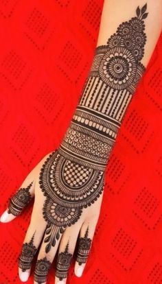 a henna tattoo on the arm and hand