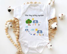 Introduce your little one to the magic of nursery rhymes with this adorable Itsy Bitsy Spider Toddler T-Shirt. Featuring the beloved rhyme and charming graphics depicting the story of the Itsy Bitsy Spider, this tee will bring joy and laughter to your child's everyday adventures. The vibrant and playful graphics capture the spirit of the Itsy Bitsy Spider tale, creating a visual delight for both kids and parents.   This Itsy Bitsy Spider Toddler T-Shirt also makes a perfect gift for birthdays, b Playful Short Sleeve Onesie With Cartoon Print, Fun Short Sleeve Onesie For Playtime, Playful Short Sleeve Onesie With Funny Print, Halloween Cotton Onesie For Playtime, Halloween Playtime Cotton Onesie, The Itsy Bitsy Spider, Spider Shirt, Playful Graphics, Itsy Bitsy Spider