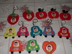 a bunch of different shaped keychains with pictures on the front and back of them