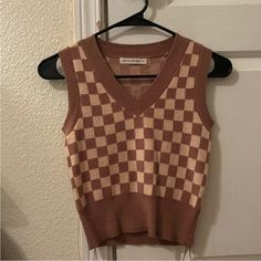 Nwot Size Small Brown And Tan Checkered Super Soft Tags Removed But Never Worn Beige Urban Outfitters Tops For Fall, Urban Outfitters Brown Sleeveless Top, Urban Outfitters Beige Tops For Fall, Retro Urban Outfitters Tops For Fall, Sleeveless Brown Top From Urban Outfitters, Checkered Sweater Vest, Sweaters Brown, Checkered Sweater, Sweater Pin