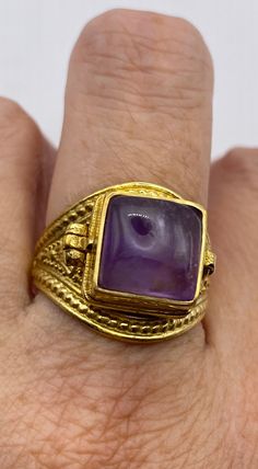 Vintage Purple Amethyst Brass Poison Pillbox Ring Collectible Gold Jewelry With Stone Setting, Gold Rectangular Cabochon Rings, Rectangular Cabochon Gold Rings, Rectangular Gold Cabochon Rings, Spiritual Gemstone Signet Ring As Gift, Gold Jewelry With Stone Setting For Collectors, Adjustable Gold Amethyst Ring Gift, Antique Brass Signet Ring Gift, Vintage Cabochon Amethyst Ring Gift