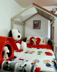 a child's bedroom with a bed and stuffed animals