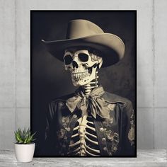 a skeleton wearing a cowboy hat is shown in this black and white photo with a potted plant