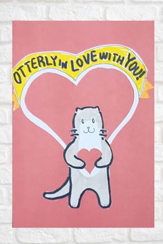 a drawing of a cat holding a heart with the words otterly in love with you on it