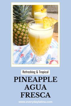 a pineapple agua fresca in a glass next to a pineapple