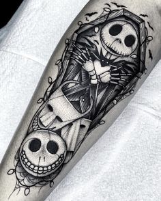 a man's leg with a skeleton tattoo on it